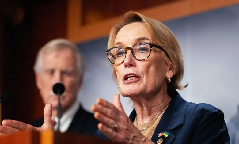 Senator Susan Collins speaking at a press conference, gesturing with her hands.