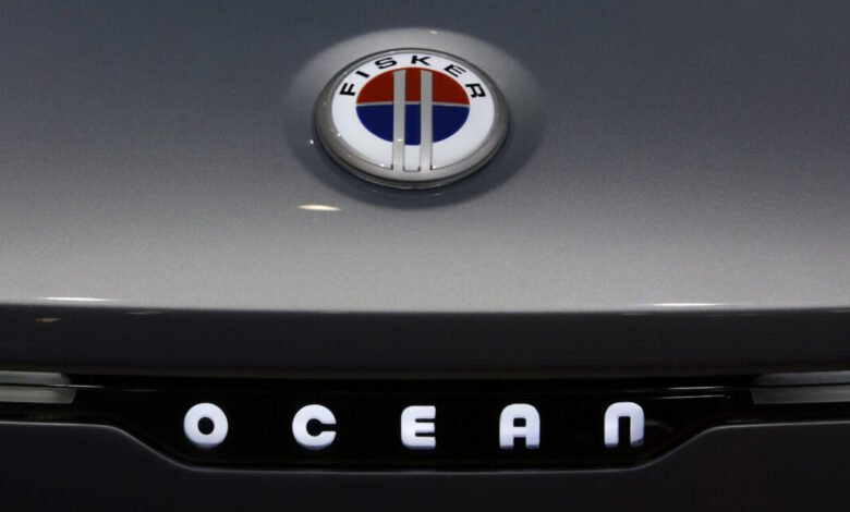 Fisker Ocean logo and nameplate on a gray electric vehicle.