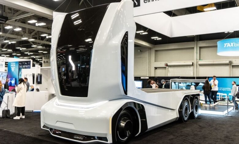 Einride electric truck on display at SXSW conference, sleek white design.