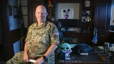 Major General Stephen Purdy in uniform poses in his office.