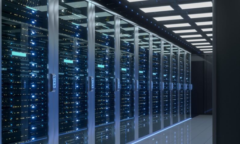 Server room with rows of data storage racks and blinking lights.