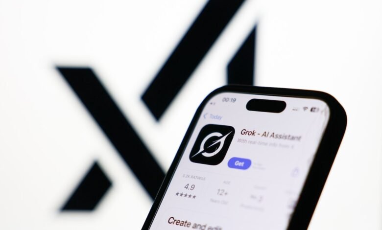 Smartphone displaying Grok AI Assistant app against blurred X logo.