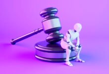 Robot figure sits pensively next to a judge's gavel and sounding block.