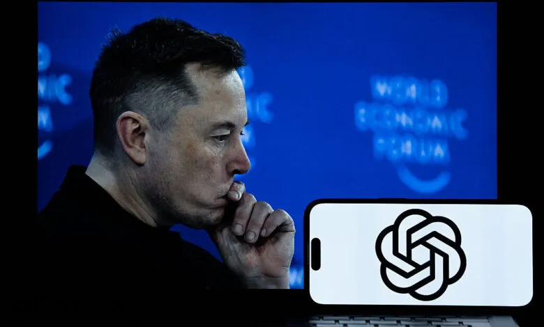 Elon Musk in profile with OpenAI logo on a phone screen.