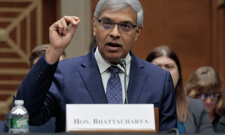 Jayanta Bhattacharya testifies at Senate hearing, raising his hand.
