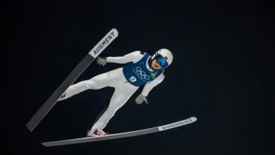 Ski jumper Qiwu Song soars during Milano Cortina 2026 training.