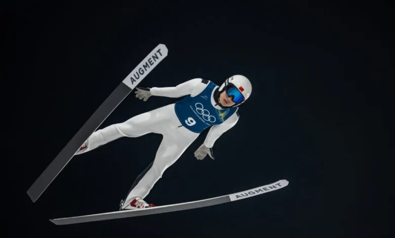 Ski jumper Qiwu Song soars during Milano Cortina 2026 training.