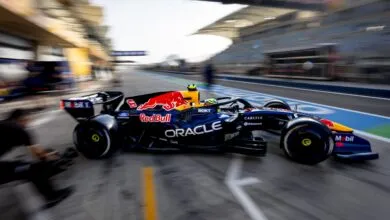 Formula 1 car speeds down track during pre-season testing.