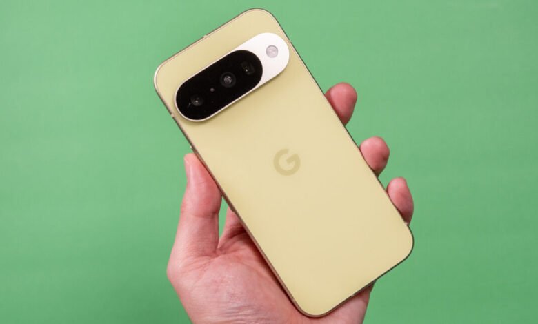 Hand holding a Google Pixel phone with a distinctive camera bar.