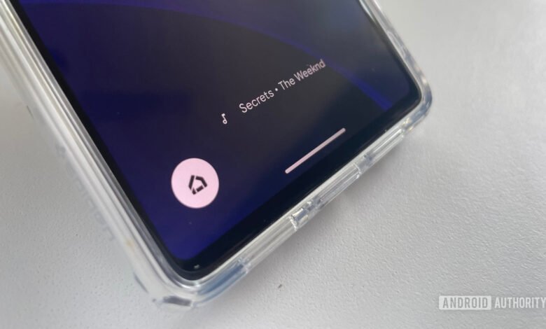 Phone screen displaying 'Secrets' by The Weeknd in Now Playing.