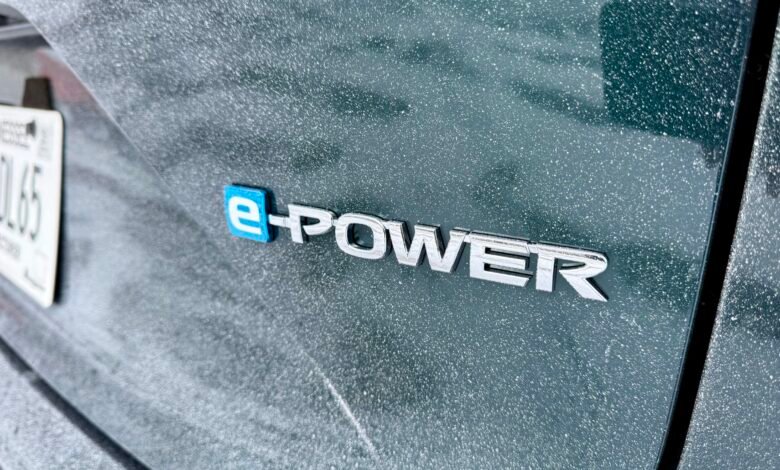 Close-up of a car's rear with an 'e-POWER' emblem and a Tennessee license plate.