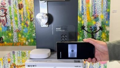 Nuki smart lock system with keypad and phone integration on display.