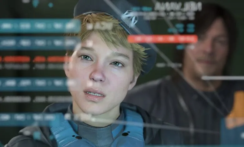 Léa Seydoux and Norman Reedus in Death Stranding 2, looking at a screen.