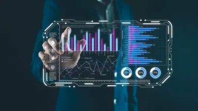 Person interacts with futuristic interface displaying data charts and graphs.