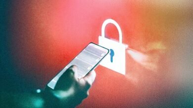 Hand holding smartphone with padlock symbol, representing mobile security.