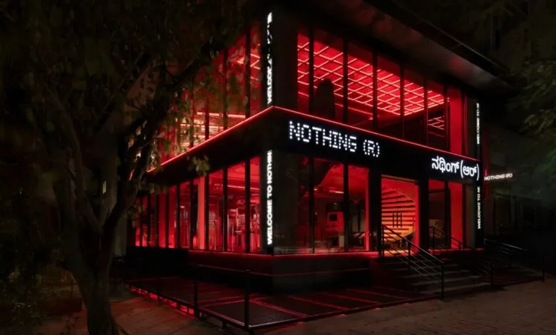 Nothing India store exterior at night, illuminated with red lighting.
