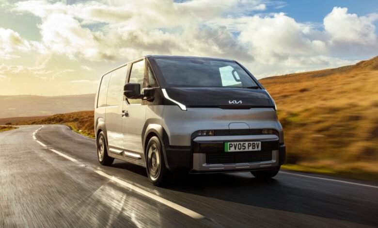 Silver Kia PBV electric van driving on a winding road with golden hills.