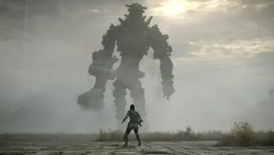 A lone warrior faces a towering stone colossus in a misty landscape.