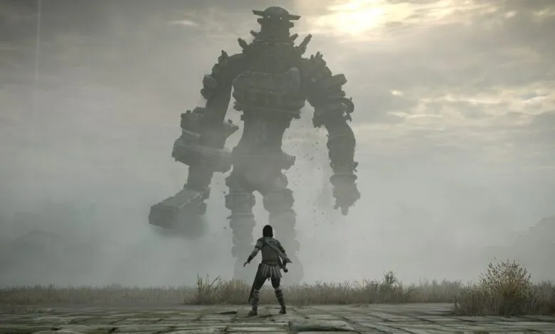 A lone warrior faces a towering stone colossus in a misty landscape.