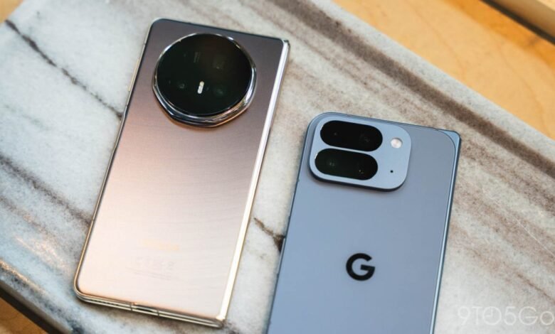 Two smartphones, a Google Pixel and Honor Magic, on a marble surface.