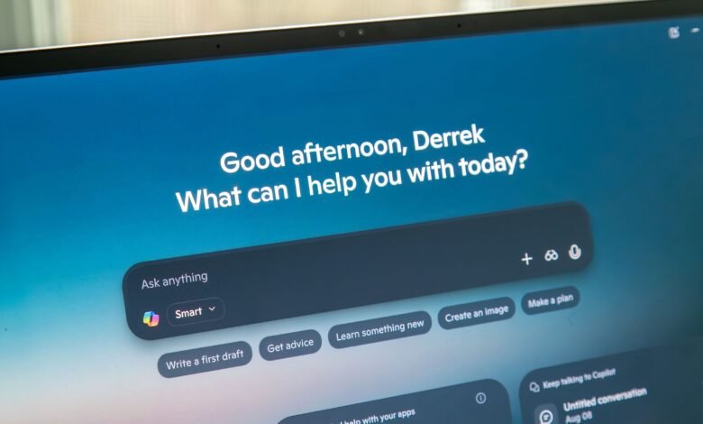 Laptop screen showing Copilot AI interface with personalized greeting.