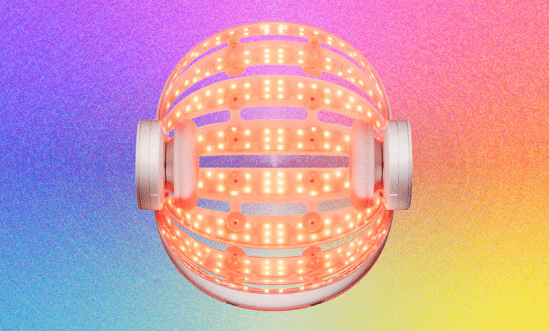 LED hair growth helmet with red lights on a colorful background.