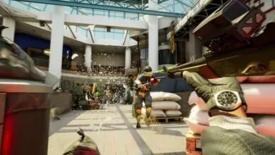 First-person view of intense firefight in a modern shopping mall.