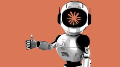 Friendly robot giving a thumbs up with a flower design on its screen.