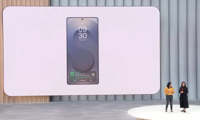 Two women present a new phone with Uber Eats notification on a large screen.