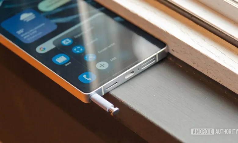 Close-up of a smartphone with its stylus partially ejected.
