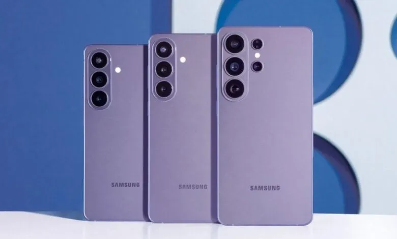Three lavender Samsung Galaxy phones standing upright, back view.