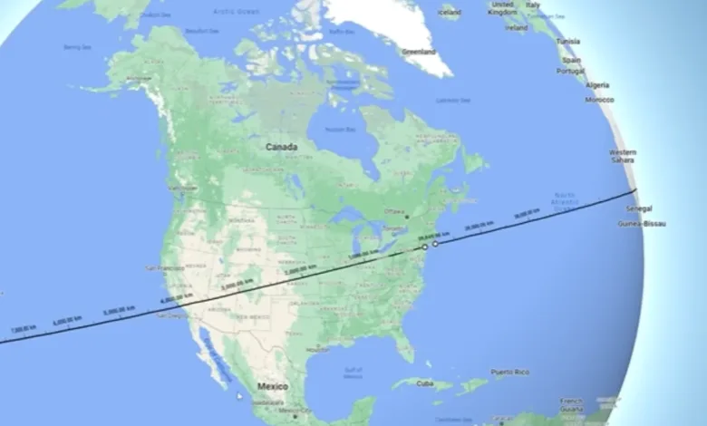 Map showing a line across North America and Africa with distance markers.