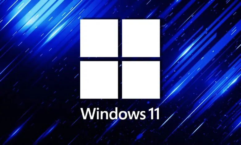 Windows 11 logo with four white squares on a blue background.