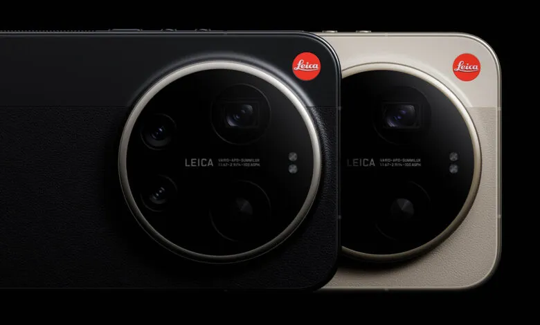Close-up of two smartphones with Leica camera systems, one black and one beige.