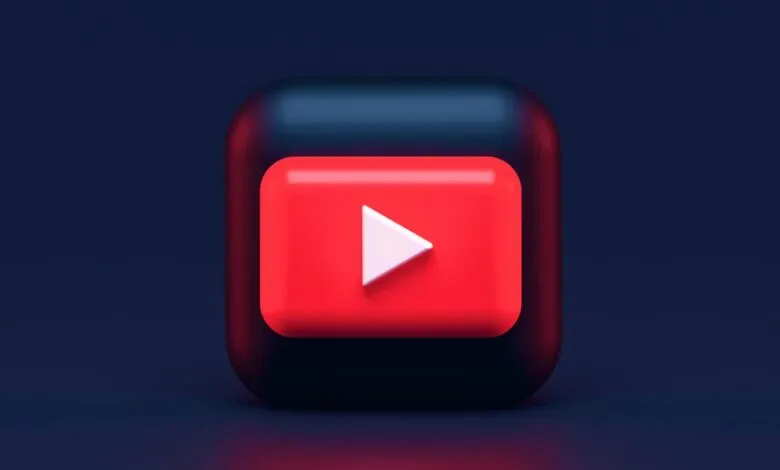 3D rendering of the YouTube play button icon on a dark background.