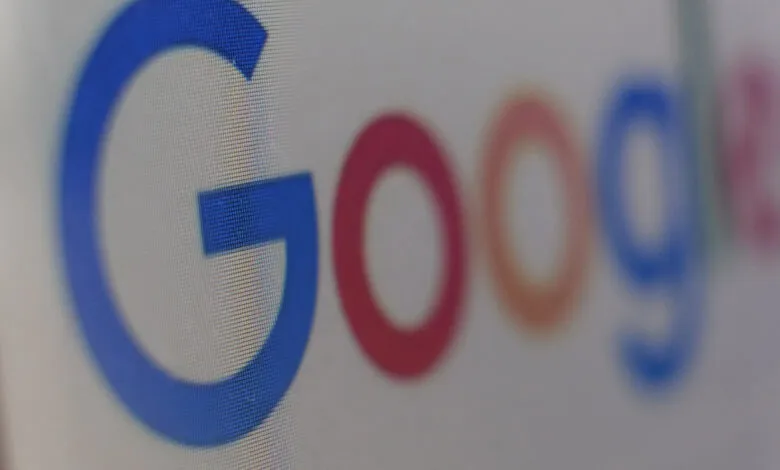 Close-up of the Google logo displayed on a digital screen.