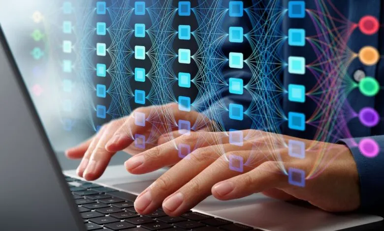 Hands typing on laptop with AI neural network visualization overlay.