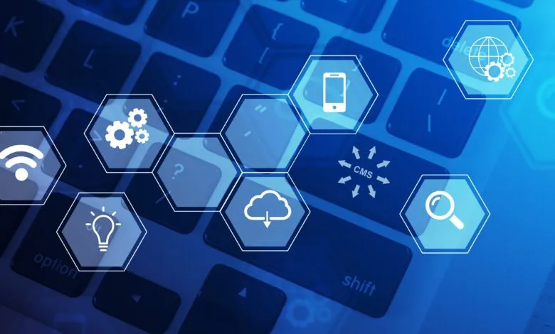 Keyboard with technology icons overlayed, representing digital concepts.