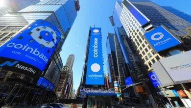 Coinbase billboards in Times Square, New York City, on a sunny day.