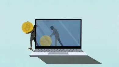 Illustration of masked figures stealing Bitcoin from a laptop screen.