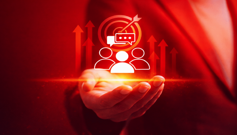 Hand holding customer service icon with target and upward arrows.