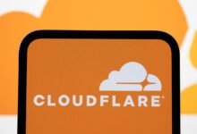 Cloudflare logo displayed on a smartphone screen with cloud background.