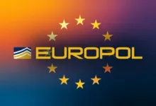 Europol logo with gold stars on a gradient background.