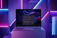 Laptop on a pedestal with a vibrant, colorful display and neon lighting.