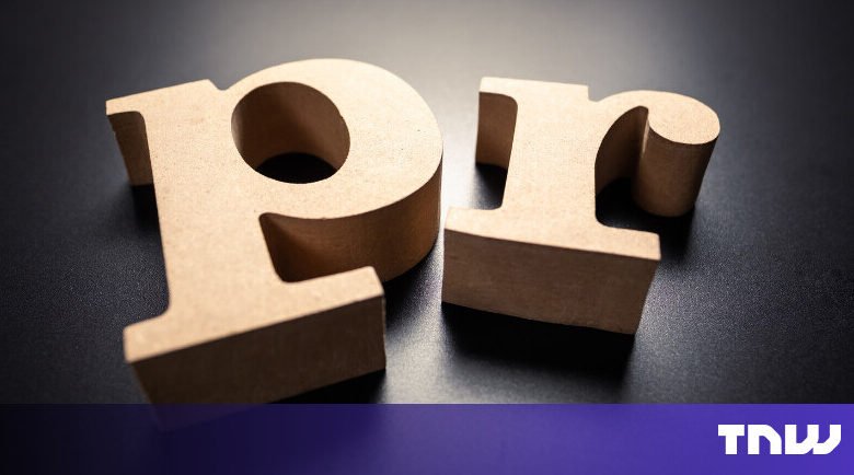 Wooden letters 'PR' on a dark surface, close-up shot.