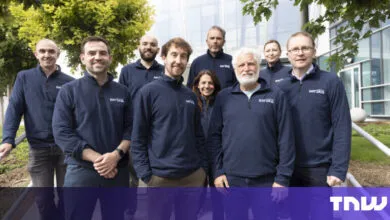 Group of nine people wearing matching navy blue sweaters with the word 'aerska' on them.