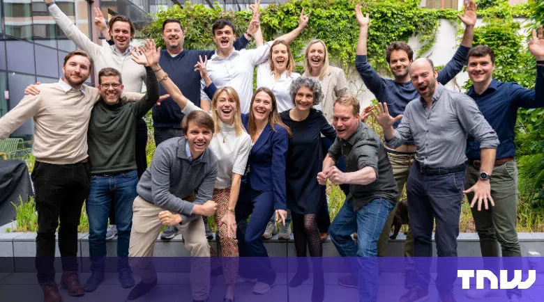 Enthusiastic group of diverse professionals celebrating outdoors.