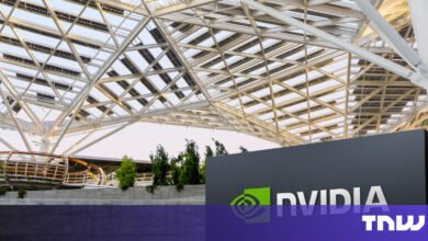 NVIDIA logo sign in front of modern building with solar panel roof.