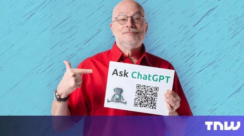 Man holds 'Ask ChatGPT' sign with QR code, pointing at it.