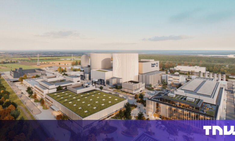 Rendering of a large, modern industrial complex with green roofs and cylindrical structures.